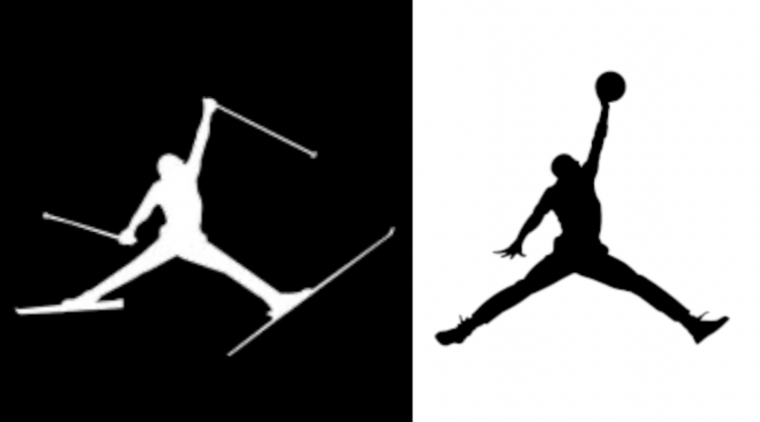 Two silhouettes of a skier and a skier