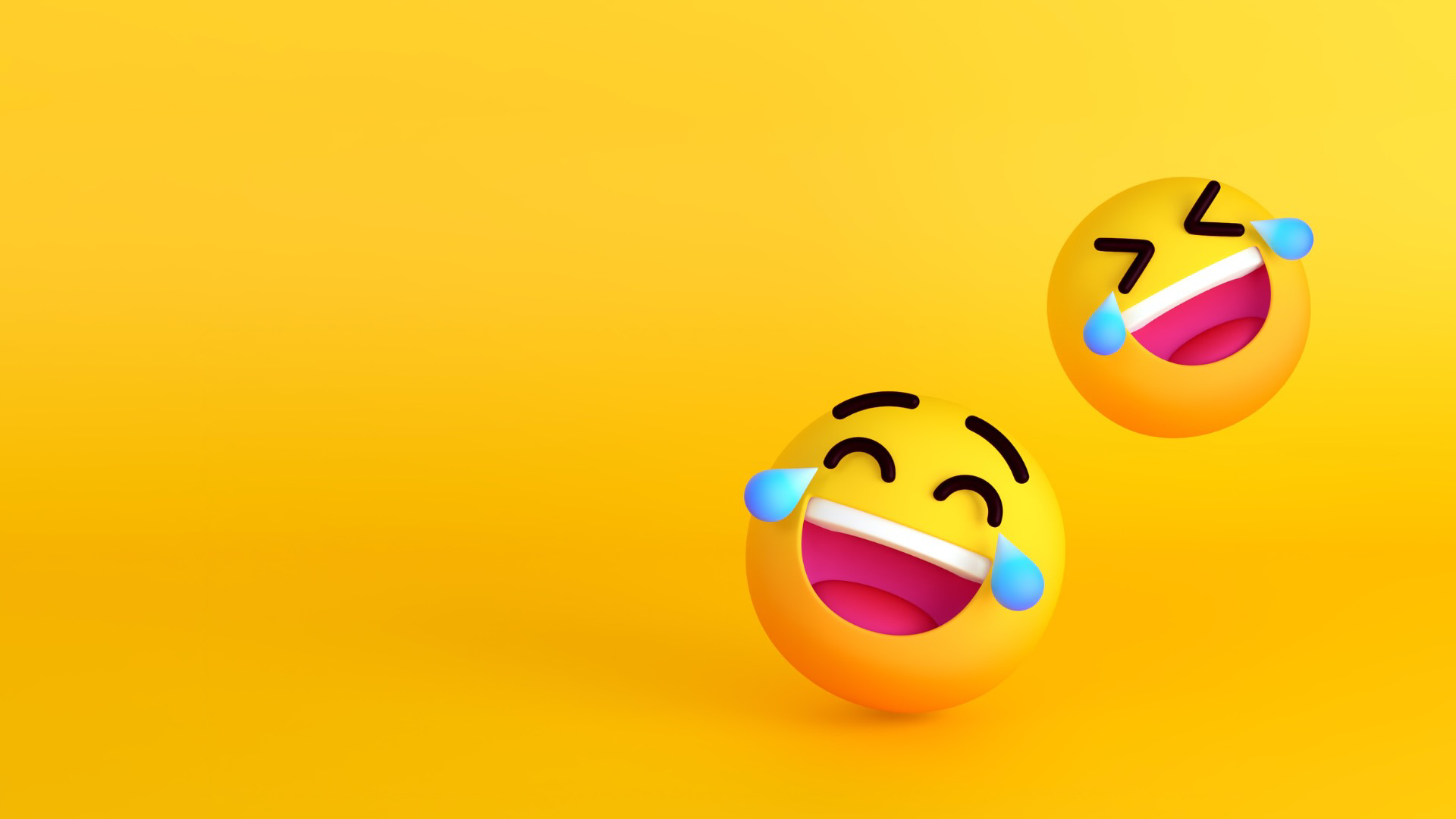 Two smiling emoticions on a yellow background